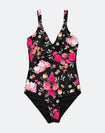 Happy mother in maternity swimsuit holding her toddler