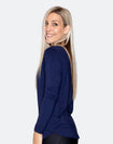 side view of an active mother wearing a blue top