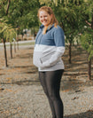 pregnant mother stays warm in a breastfeeding hooded sweatshirt