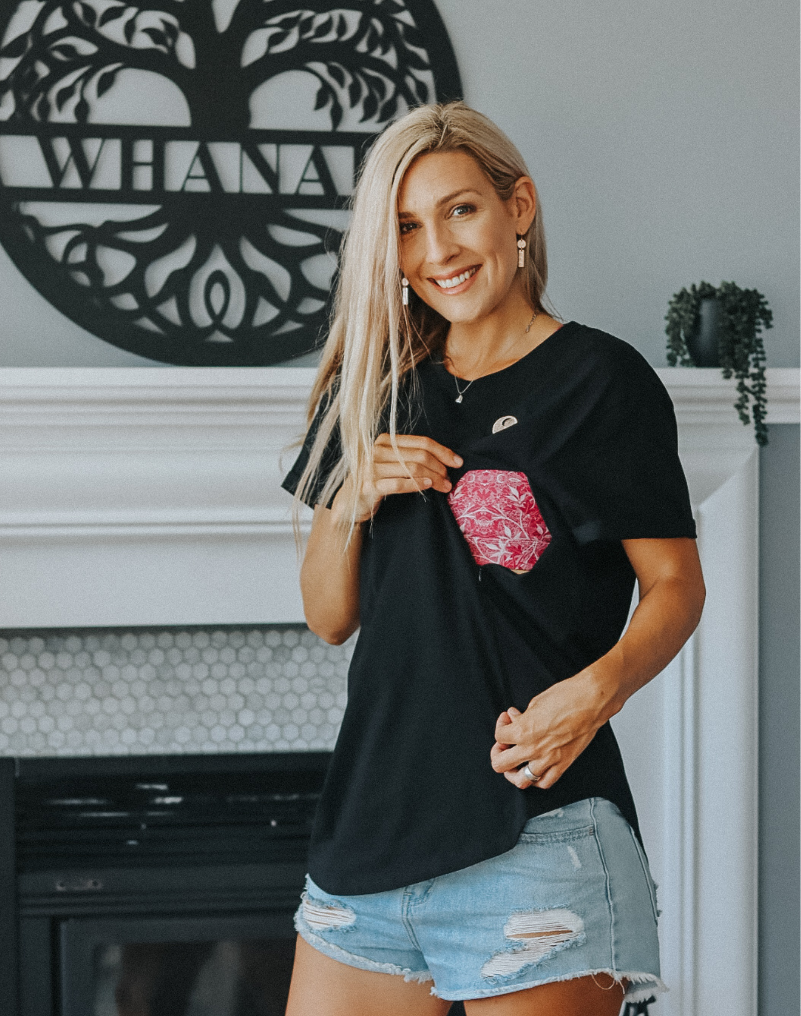 Active mother wearing comfortable and flattering black nursing tee