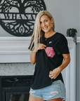 Active mother wearing comfortable and flattering black nursing tee