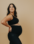 pregnant woman wearing a black racerback nursing bra back view