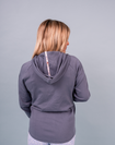 Back view of maternity sweater showing contrast print trim on the hood matching our Evolve Bra