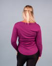 side view of happy active mum wearing magenta long sleeve nursing top with zips for breastfeeding