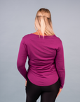 side view of happy active mum wearing magenta long sleeve nursing top with zips for breastfeeding