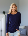 happy, fit mother wearing blue bamboo long sleeve top