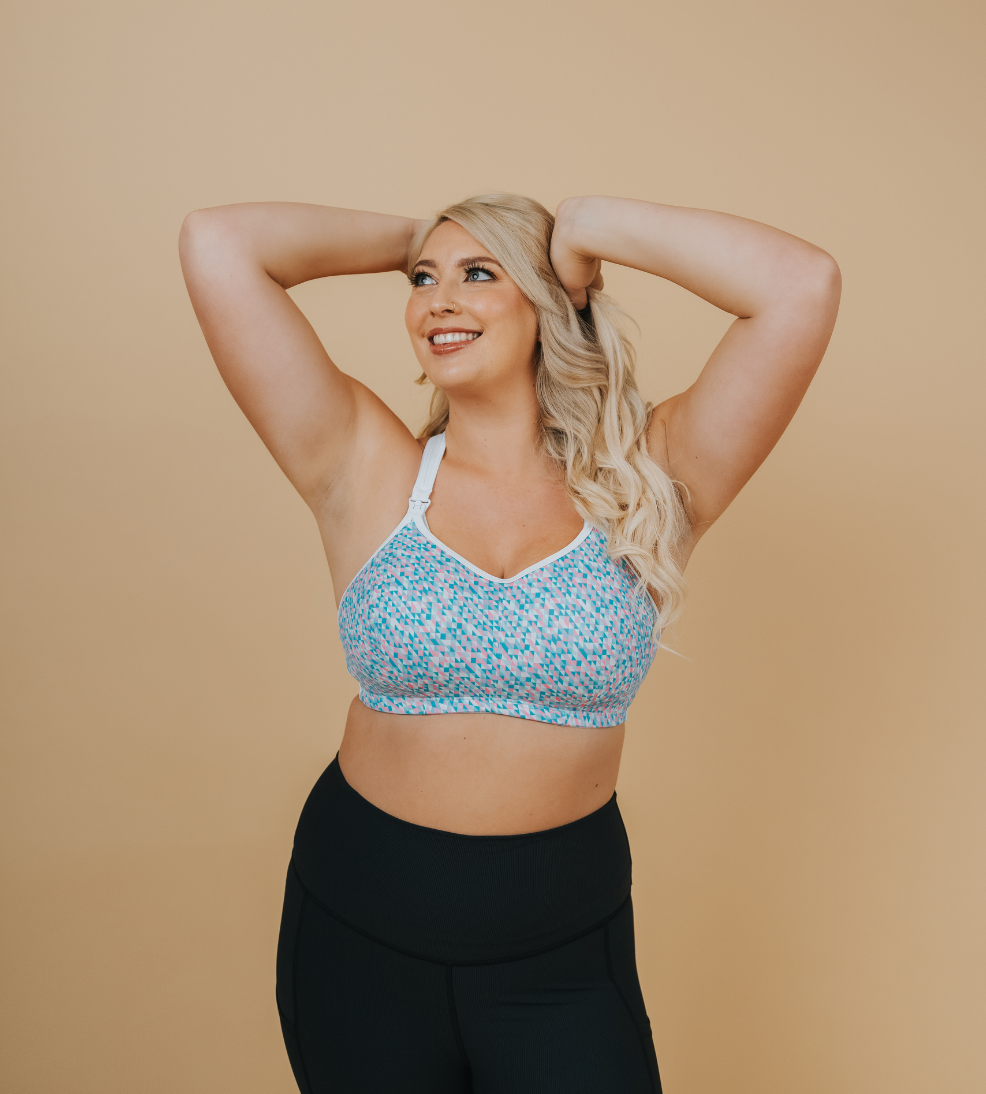 happy pregnant woman wearing her a supportive nursing bra