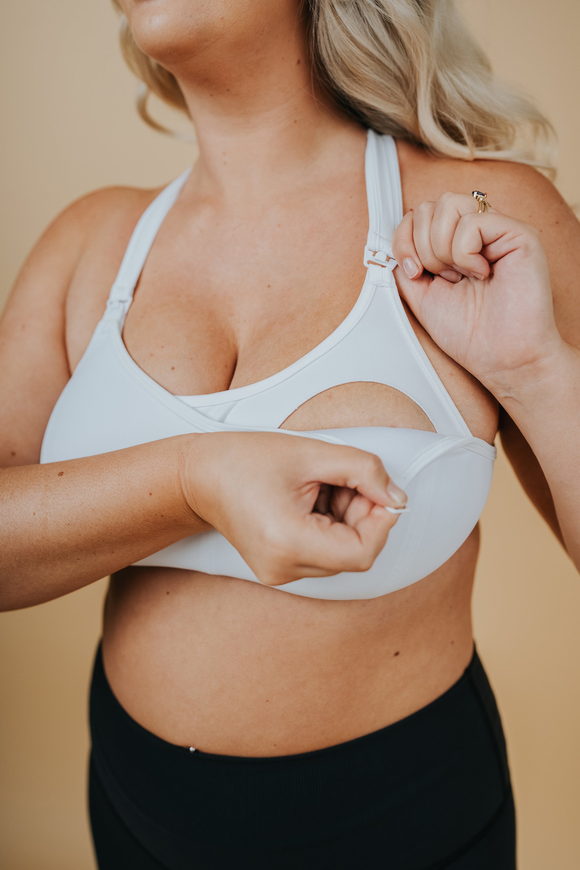 Pregnant mum showing the nursing function of a breastfeeding bra