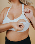 Pregnant mum showing the nursing function of a breastfeeding bra