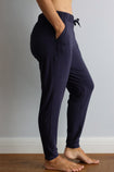 side view of a active mom wearing navy bamboo jogger pants