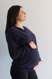 Back view of pregnant mother wearing navy breastfeeding crew neck jumper