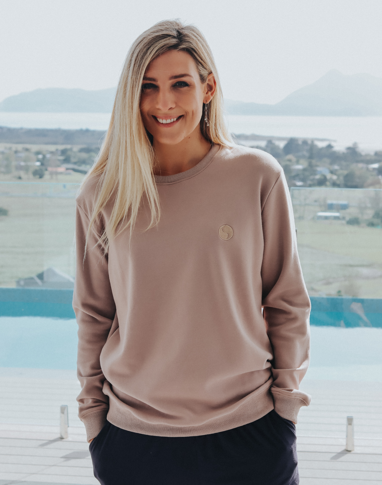 Happy mother wearing a grey women's crew neck sweatshirt