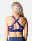 back view of a floral crossover nursing sports bra