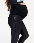 pregnant woman wearing black full length maternity leggings