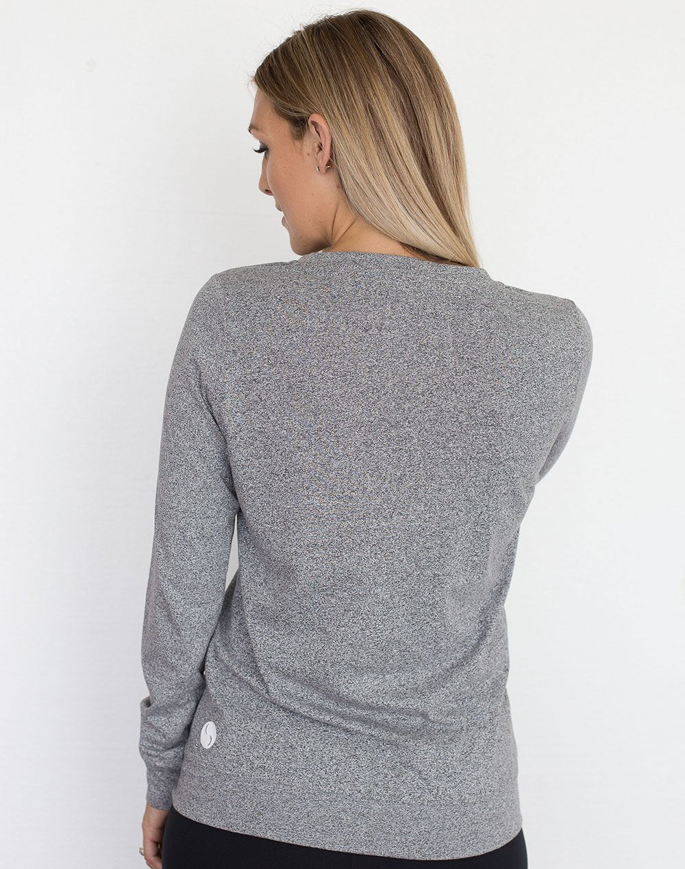 back view of a mum in a grey crew neck maternity top