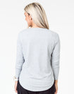 back view of a mum wearing a grey maternity top with long sleeves
