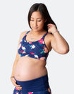 pregnant woman in a floral crossover nursing sports bra