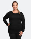 front view of an pregnant lady wearing a black maternity top with long sleeves