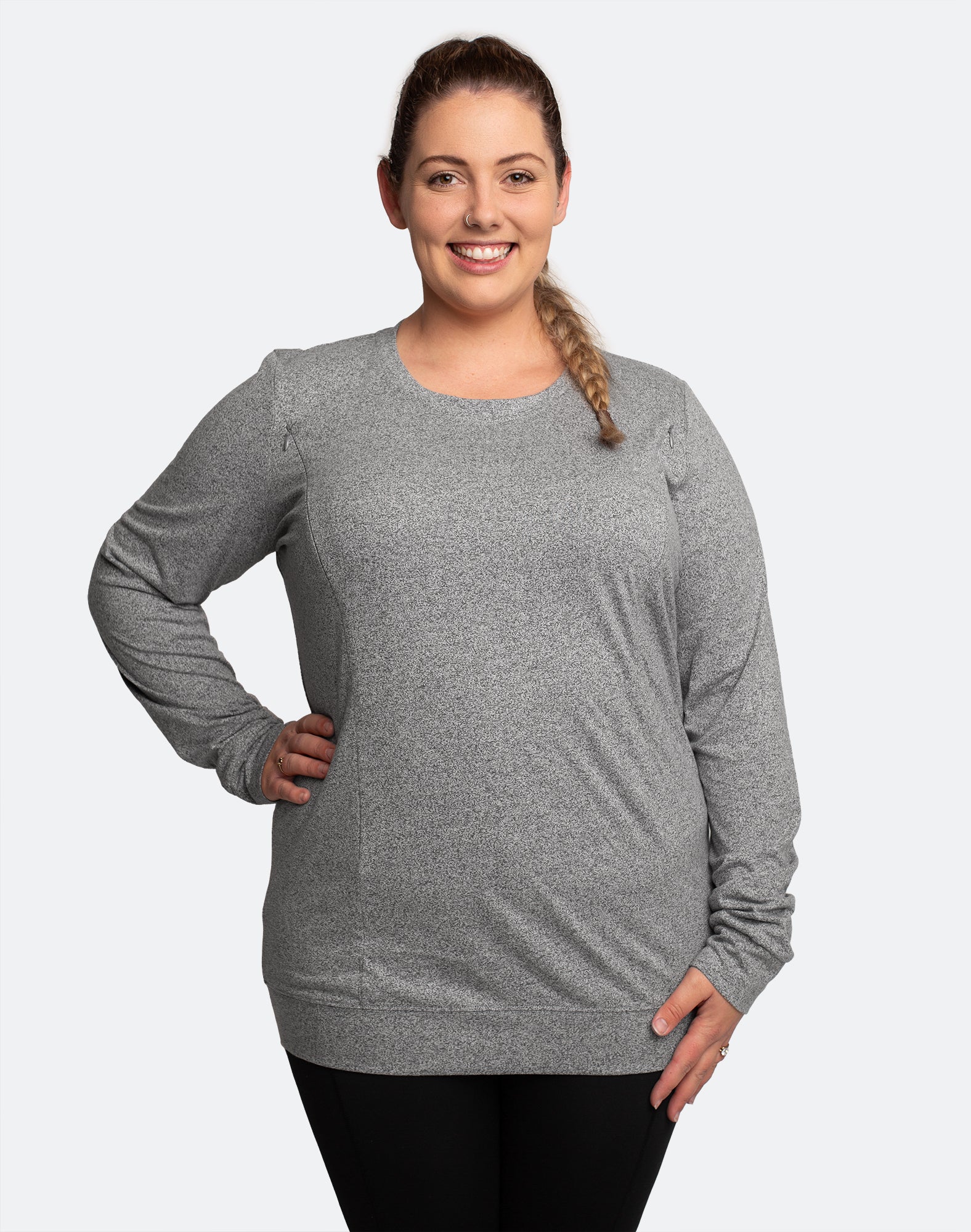 Happy mom wearing a grey nursing jumper with easy access breastfeeding zips