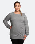 Happy mom wearing a grey nursing jumper with easy access breastfeeding zips